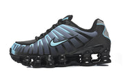 Side view of a black and blue Nike Shox TL sneaker.