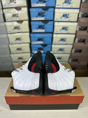 Top and heel view of the pair showing white quilted sections, black overlays, red accents and Jordan branding.