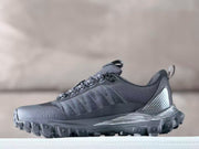Side profile of a black Alo sneaker highlighting the textured upper, layered side panels, and deep outsole lugs.