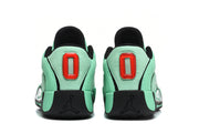 Rear view of the green and black Jordan sneakers showing the padded heels, red heel details, and black Jumpman logos.