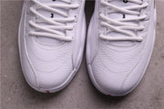 Close-up of the white laces and textured toe boxes with small red outsole details.