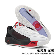 White, black and red Jordan 8812 basketball shoes shown from the side and outsole, with visible Air Zoom branding.
