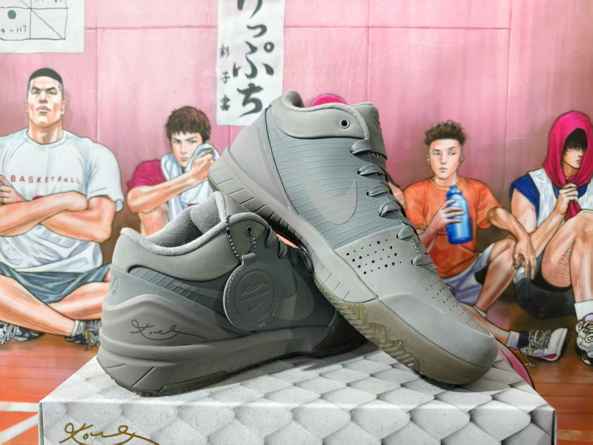 Pair of grey low-cut Nike basketball shoes shown from side and angled views