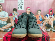 Front view of the paired wolf grey high-top basketball sneakers with multiple straps and textured tan toe outsoles.