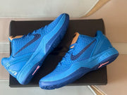 Blue Kobe 6 shoes displayed at an angle, showing the textured uppers and outsole accents.