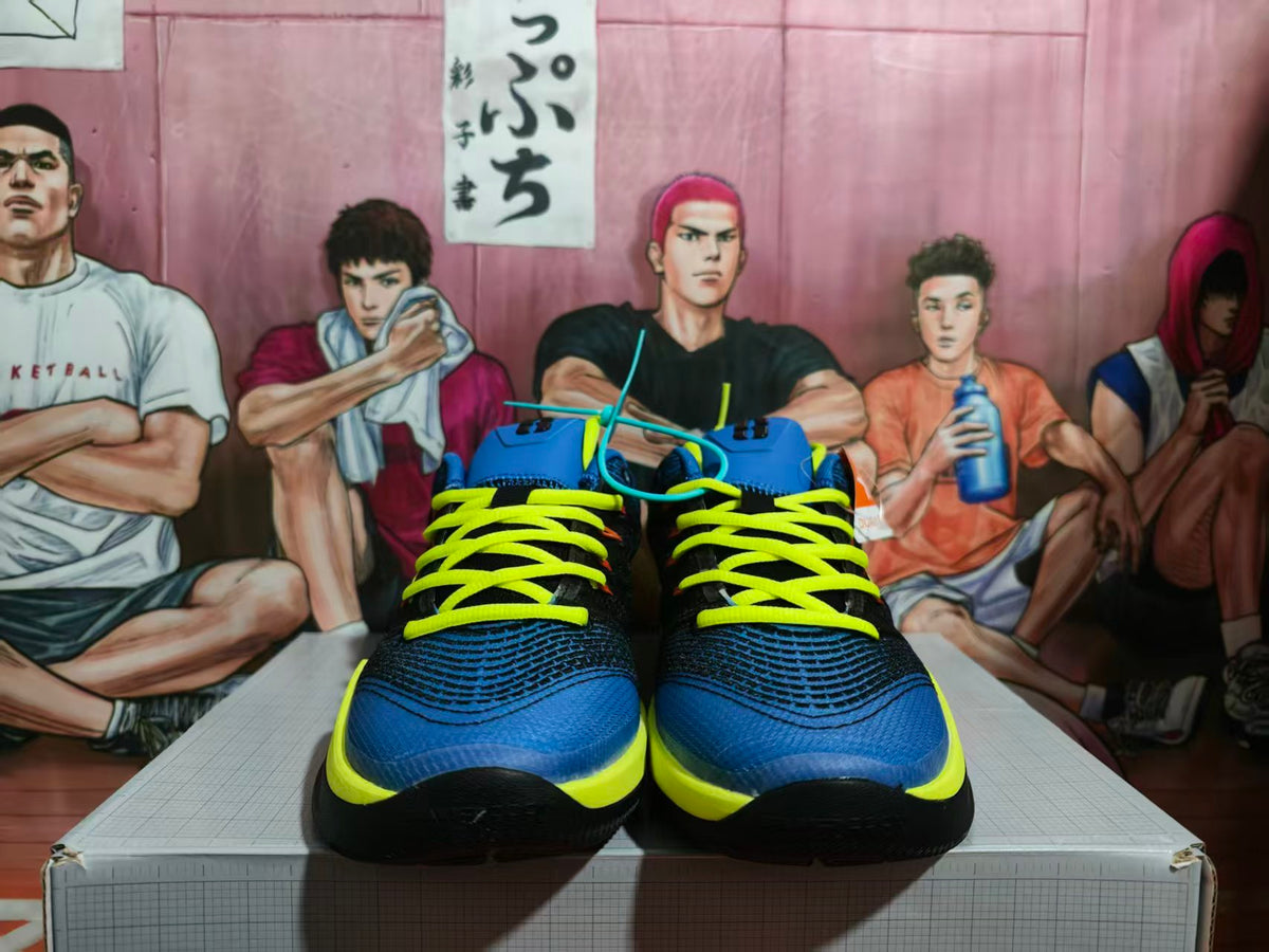 Front view of blue and black Nike basketball sneakers with bright yellow laces and yellow midsoles.