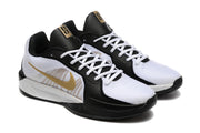 Angled view of the pair showing white laces and gold side details
