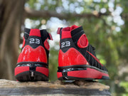Rear view highlighting the red heel panels and white 23 markings.