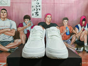 Front view of a pair of white Nike sneakers showing the matching laces, tongue panels, toe mesh, and white outsoles.