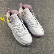 Pair of white and pink Air Jordan 12 high-top sneakers viewed from above.