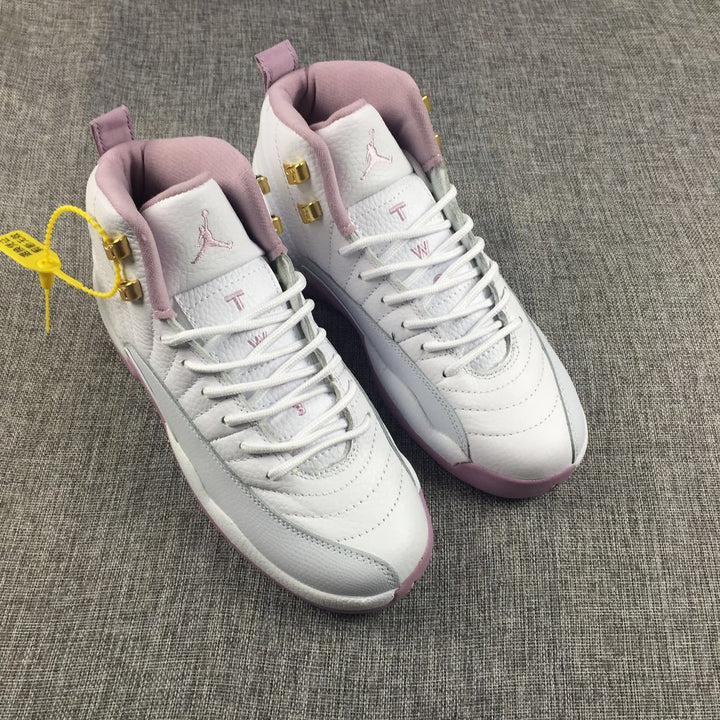 Pair of white and pink Air Jordan 12 high-top sneakers viewed from above.
