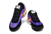 Front view of the Nike Air Max Plus Utility sneakers, showing the laces and contrasting colors.