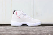 Lateral profile of the white high-top sneaker with red trim and translucent outsole.
