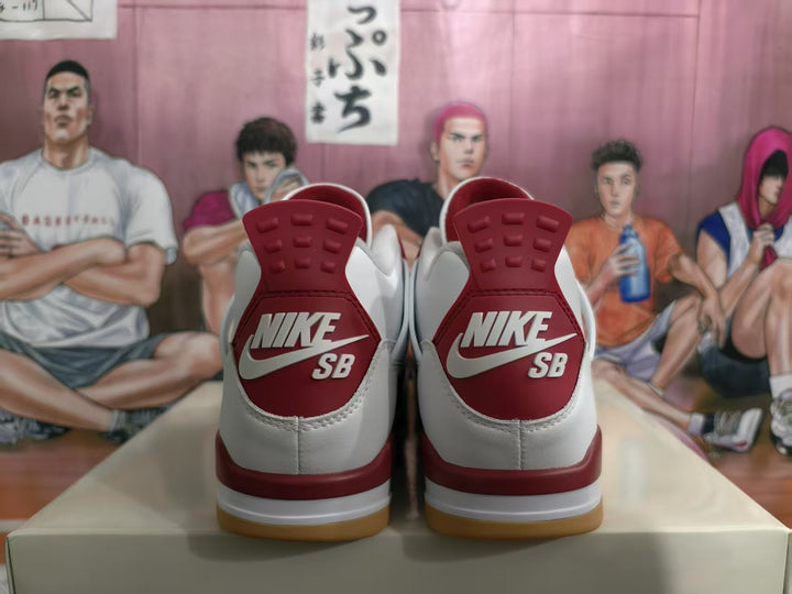 Heel view of white and grey sneakers with red Nike SB heel panels and gum-colored outsoles