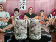 Rear view showing textured heel panels and purple “TATUM” lettering on the light pink basketball sneakers.