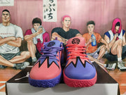 Front view of pink and purple basketball sneakers with black graphic accents
