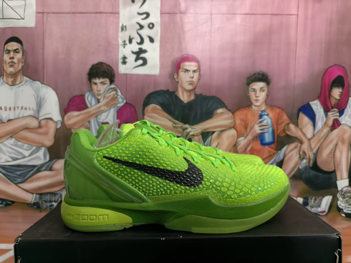 Side view of bright green Nike basketball sneakers with black side logo, textured upper, and layered green sole.