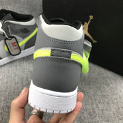 Close-up of the rear heel, stitching, fluorescent accent panel and white outsole.
