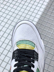 Top view of the white toe box with black laces and green-and-yellow mesh beneath the tongue.