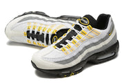 Top view of Nike Air Max 95 TT sneakers showing mesh detailing and yellow lace accents.