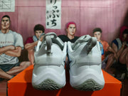 Rear view of white and silver Nike basketball shoes