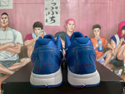 Rear view showing the blue heel panels, white midsoles, and red signature-style detailing.