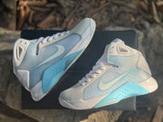 Overhead side view showing the contrasting blue midsole sections and white upper panels.