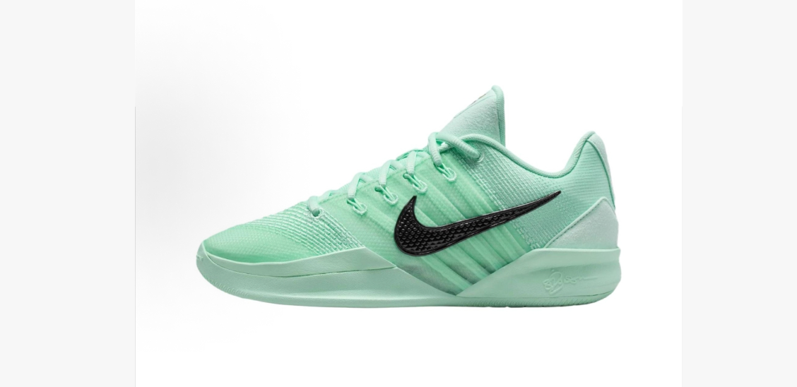Side view of green low-top sneakers with a black Swoosh-style side detail and tonal laces.