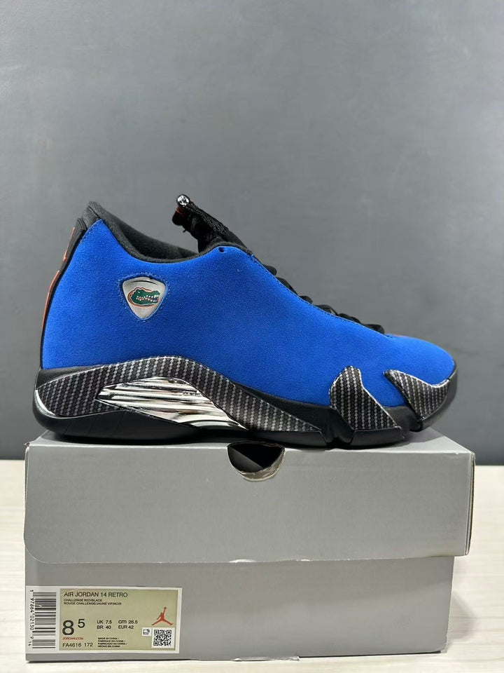 Side view of a blue and black Jordan Air Jordan 14 Retro sneaker displayed on a labeled box; the box label shows EU 42 and style code FA4616-172.