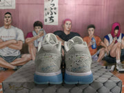 Rear view of white and grey Nike basketball sneakers with speckled heel panels and blue outsoles.