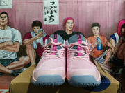 Front view of the pink and gray lace-up shoes with gray-blue toe and outsole accents.