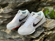 Top-angle view of a pair of white Kobe 4 basketball shoes