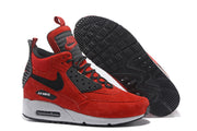 Side view and outsole of red and black Nike Air Max 90 high-top sneakers.