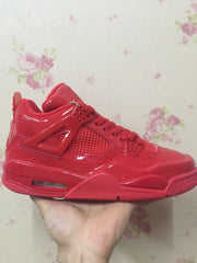 Side profile of a glossy red high-top sneaker showing the mesh panel, side wing, and sculpted midsole.