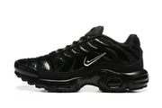 Side profile of a black Nike Air Max Plus sneaker showing its sculpted sole and glossy upper.