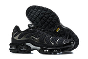 Black grid-pattern sneakers shown from the side and outsole