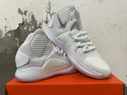Pair of white Nike high-top basketball shoes arranged together, showing gray Swoosh details and textured uppers.