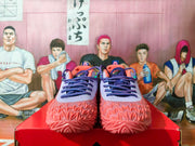 Front view of pink and lavender Nike basketball shoes with patterned laces