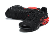 Pair of black and red Nike Air Max Plus sneakers in angled top and side views.