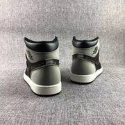 Rear view of the pair showing the gray heel panels, black collars, and white midsoles.