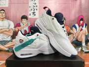 White Jordan shoes shown from an angled side view, highlighting red and navy accents.