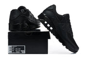 Black Nike Air Max 90 sneakers displayed with a black shoe box and size label.
