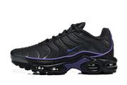 Side profile of a black Nike Air Max Plus sneaker with purple accents and visible cushioning windows