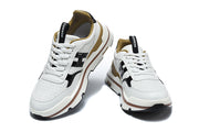Pair of white and black lace-up sneakers shown from front and angled views.