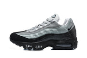 Side profile of a grey and black Nike Air Max 95 sneaker