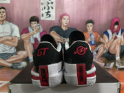Rear view of the pair showing Nike branding, GT-style heel graphics, and red heel details.