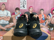 Rear view showing gold ASICS logos on the black Metarise shoes
