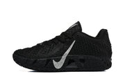 Side view of a black low-top sneaker with a silver swoosh, textured upper, and patterned sole.