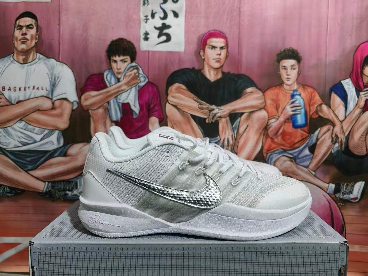 White and silver Nike Kobe basketball shoe shown from the side