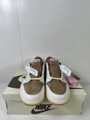 Front view of the pair showing brown perforated toe boxes, white toe overlays, brown tongues, and white laces.